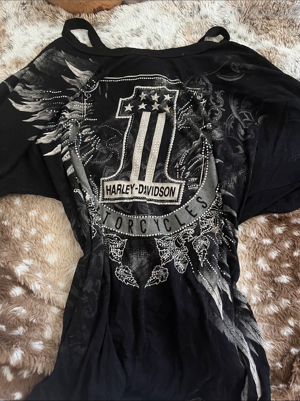 Harley-Davidson Black Short Sleeve Graphic Shield Tee off the shoulder.